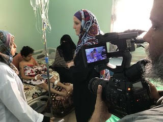 Media team reporting in a conflict area