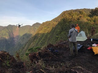 Expedition team operating in mountainous terrain