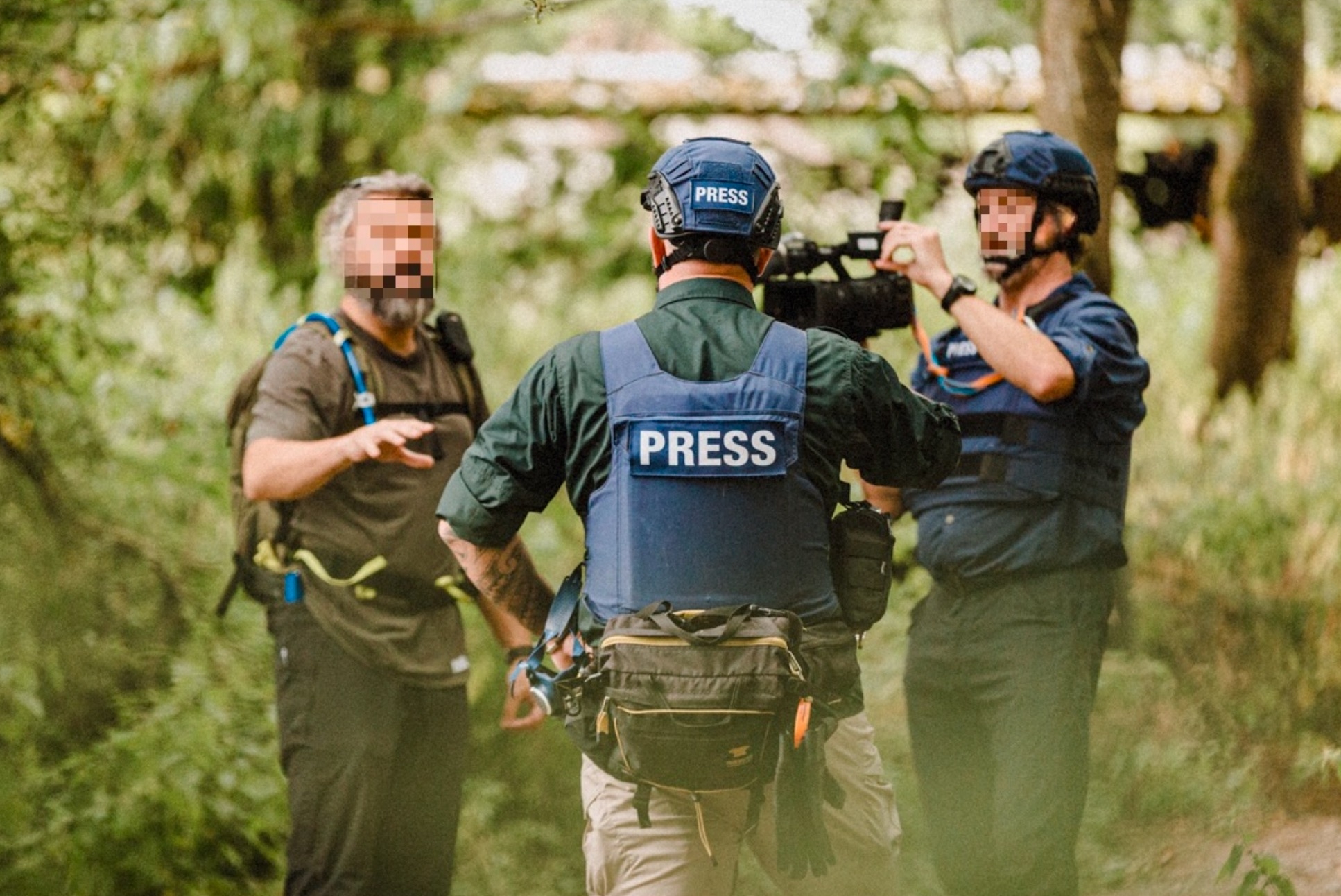 Media safety advisor training with press crew in woodland